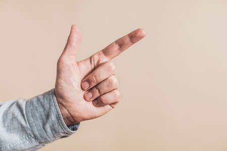 Close up image of male hand pointing.の写真素材