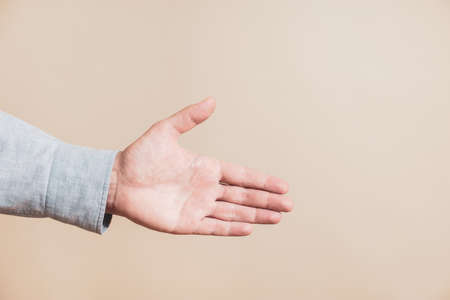 Close up image of male hand showing handshaking gesture.の写真素材