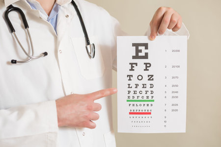 Image of male doctor  doing eye exam.