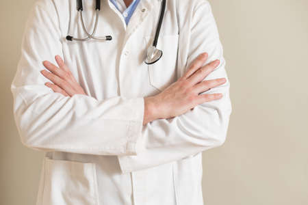 Portrait of male doctor with arms crossed.の写真素材