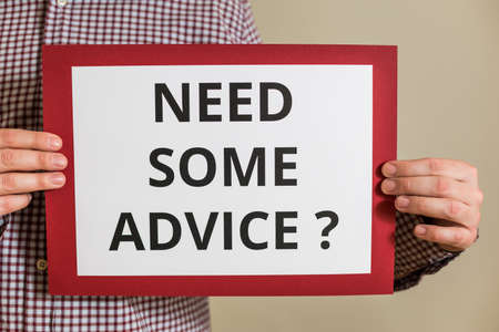 Image of man holding paper with text need some advice.の写真素材