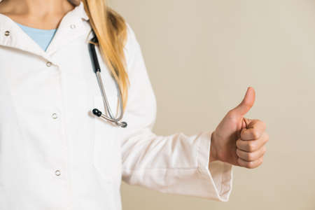 Image of female doctor showing thumb up.の写真素材
