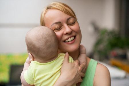 Mother enjoys spending time with  her little cheerful baby boy.の写真素材