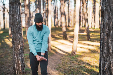 Man with beard enjoys exercising in nature.の写真素材