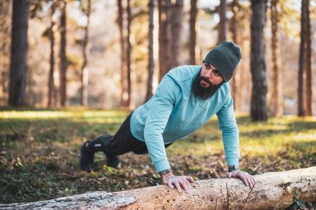 Man exercising push ups in nature.