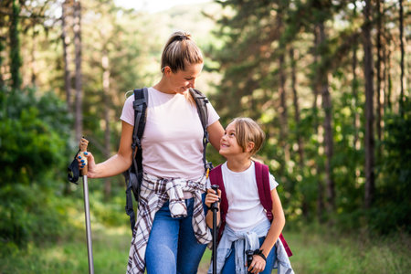 Mother and daughter enjoy hiking together.の写真素材