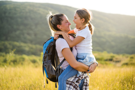 Happy mother and daughter enjoy spending time together in nature.の写真素材
