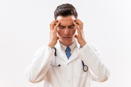 Image of tired doctor having headache.の写真素材