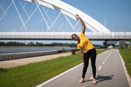 Young woman enjoys exercising outdoor.