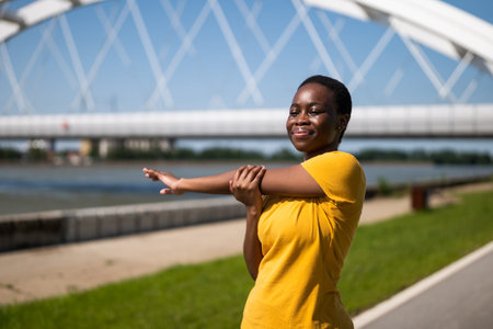 Young woman enjoys exercising outdoor.