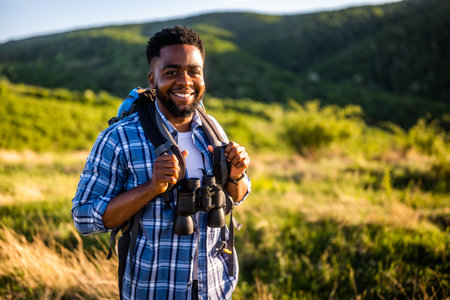 Young man enjoys hiking in nature.