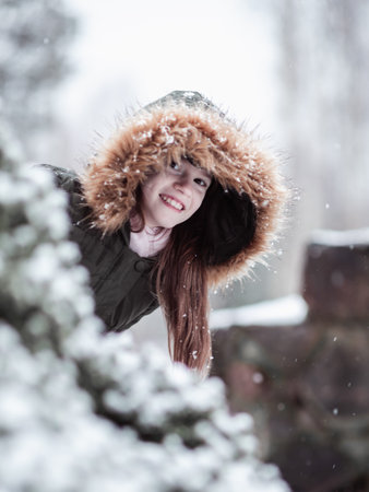 A girl with a situ hood on her head.
