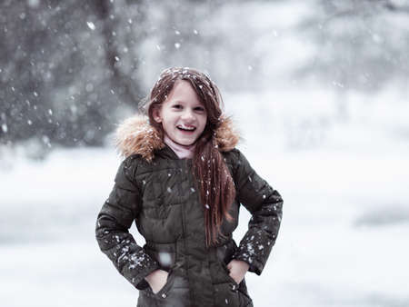 The girl is happy about the snow.の写真素材