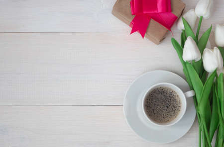 Coffee mug with a bouquet of tulips, gift box. Happy Mothers Day, Womens Day.の写真素材