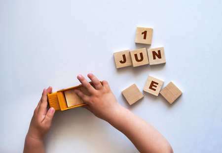 child playing with wooden cubes with lettersの写真素材