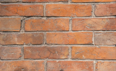 Weathered stained old brick wall background. grange
