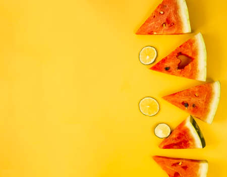 watermelon slices on a yellow background. summer juicy flatlayの写真素材