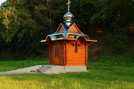 Of spring green trees is a wooden churchの写真素材