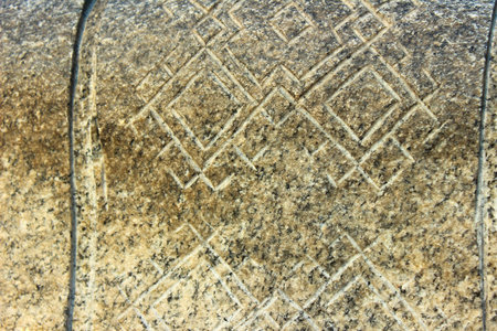 on a stone carved ethnic pattern in the form of diamonds