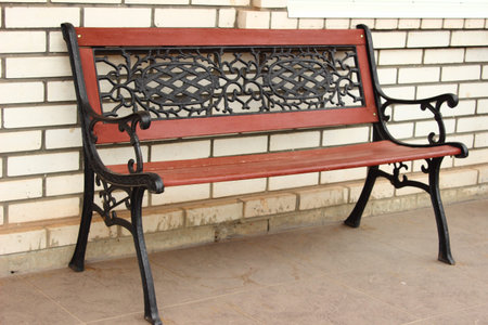 near the building is a bench to restの写真素材