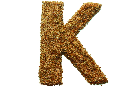 on a white background from flax seeds lined letter kの写真素材