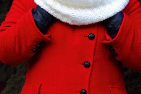 in winter weather warm hands under a scarf