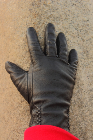 shows a portion of a gloved hand blackの写真素材