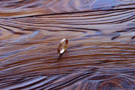 on a wooden board is the wedding ringの写真素材