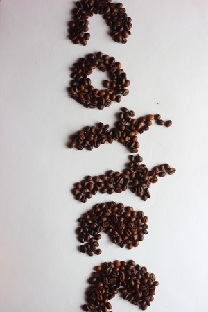 from coffee beans laid out the word coffeeの写真素材