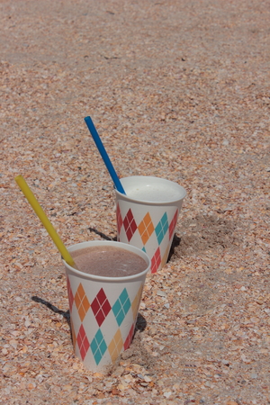 relaxing on the beach with a milk cocktailの写真素材