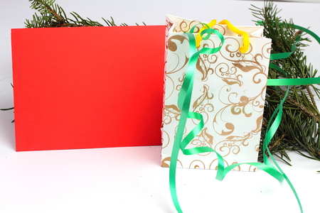 Christmas decoration with greeting card isolated on whiteの写真素材