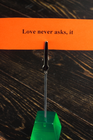 on a sheet of orange statement about true loveの写真素材