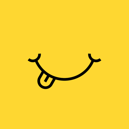 smile with tongue on yellow backgroundの写真素材