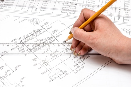 Pencil in hand on white backgroundの写真素材