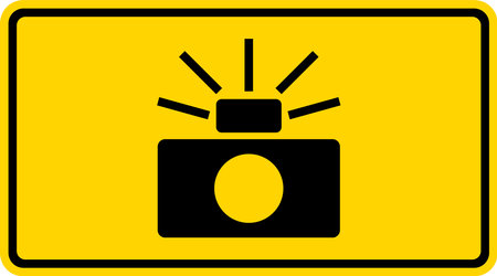 Photo enforced sign (symbol plaque). Black on yellow background. Traffic signs and symbols.のイラスト素材