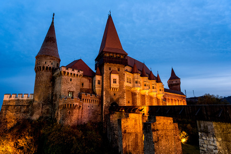The gothic medieval fortress of Hunedoara in Romania, shot in the blue hourのeditorial素材