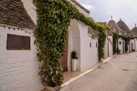The charming street of Alberobello in southern Italy with typical architecture and Mediterranean atmosphereの写真素材