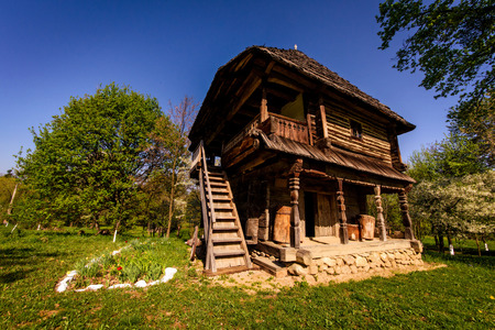 Wooden home architecture in the rural side of Romania displayed in a village museumのeditorial素材