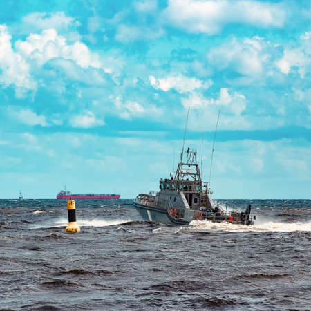 Grey military ship sailing at Baltic sea. Border guard serviceの写真素材