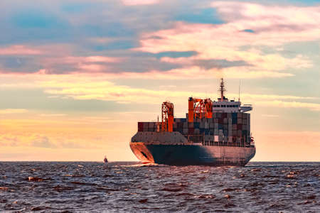 Blue container ship. World logistics and production transferの写真素材