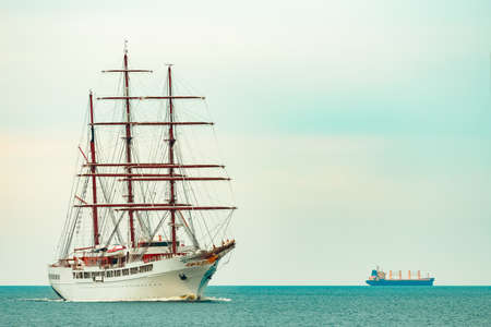 Big white sailing ship with three mast moving to the Riga portの写真素材