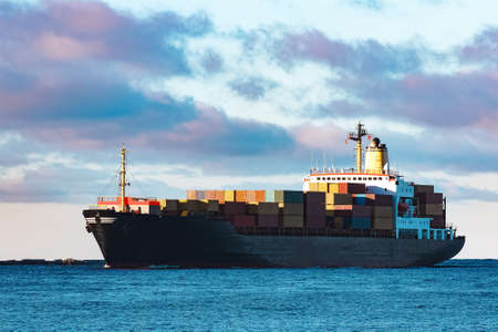 Modern black container ship moving from Baltic seaの写真素材