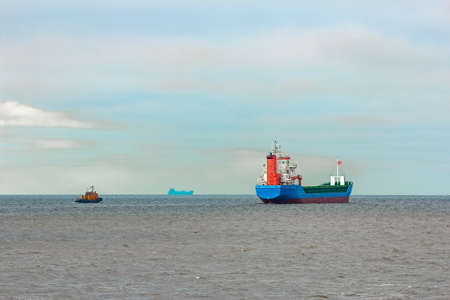 Blue cargo ship entering the Baltic sea. Riga, Europeの写真素材