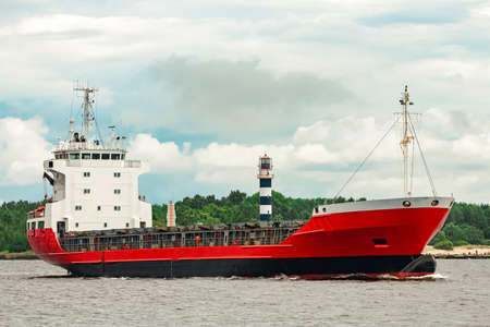 Red new cargo ship moving abroad. Product export in Europeの写真素材