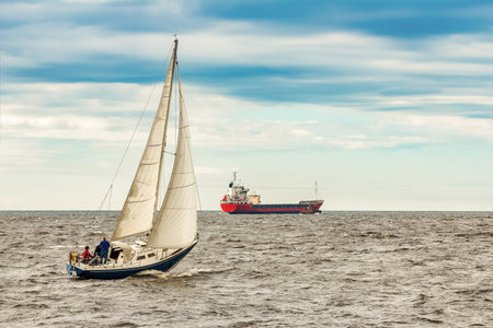 Blue sailboat in travel by Europe. Sea journeyの写真素材