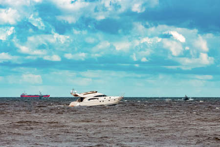 White speed boat moving fast to the Baltic sea. Water sportの写真素材