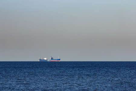 Blue cargo ship sailing from the Baltic seaの写真素材