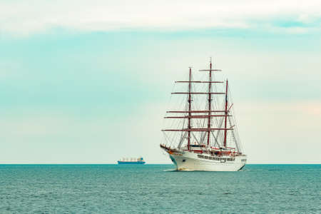 Big white sailing ship with three mast moving to the Riga portの写真素材
