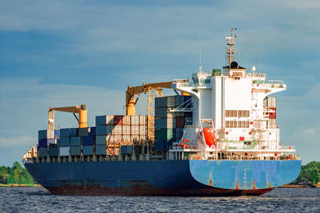 Blue container ship. World logistics and production transferの写真素材