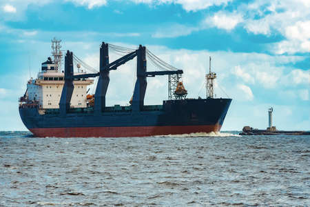 Merchandise import. Large blue cargo ship moving to Riga portの写真素材
